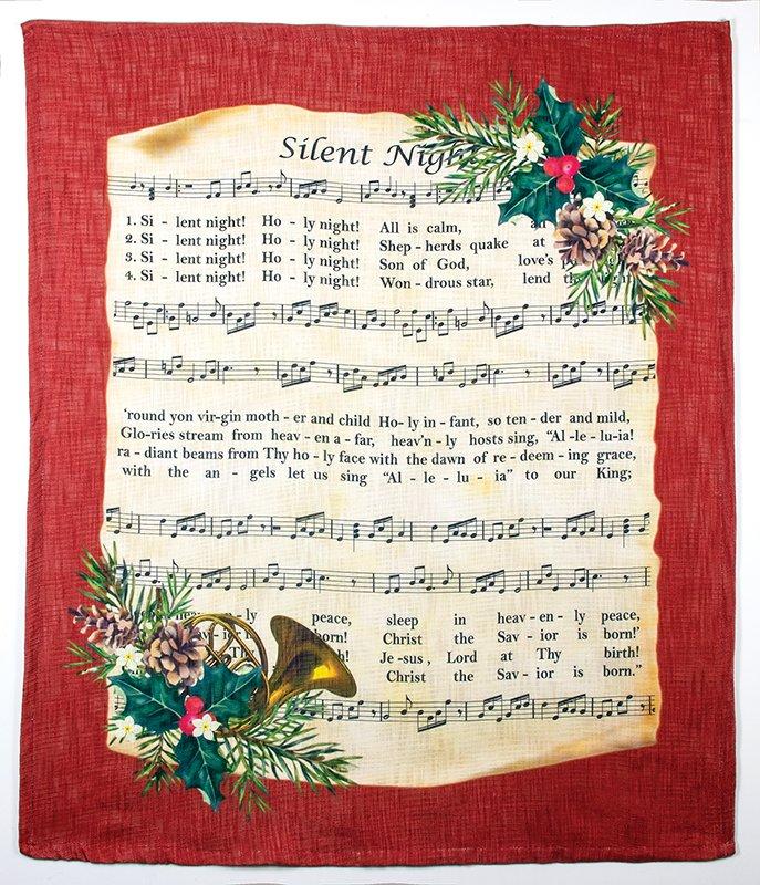 Red blanket with sheet music of Silent night with holiday garland