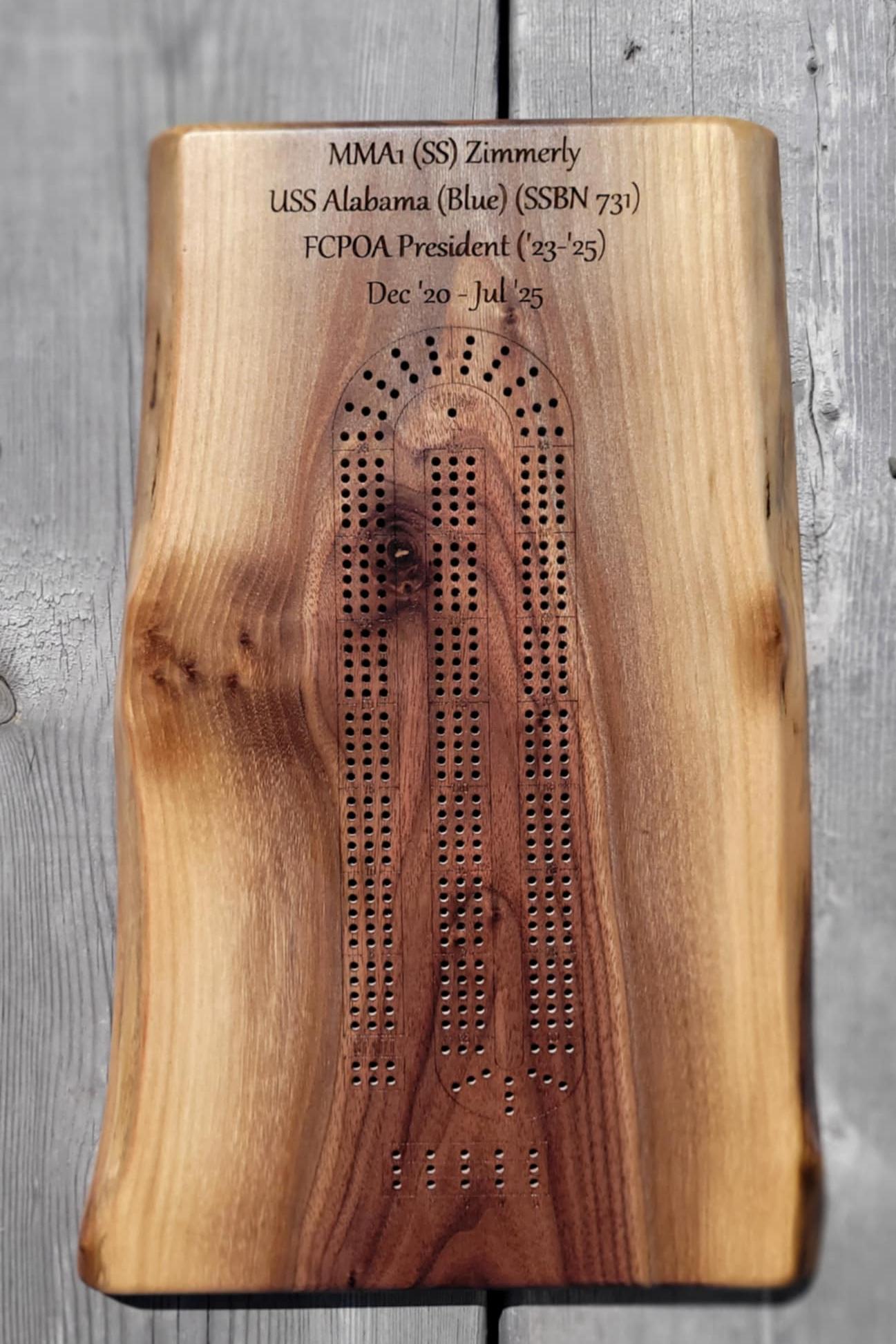 walnut live edge cribbage boards to naval colleagues. Each one is deeply personal, featuring their official rank, the vessel they served on, and the years they spent together.