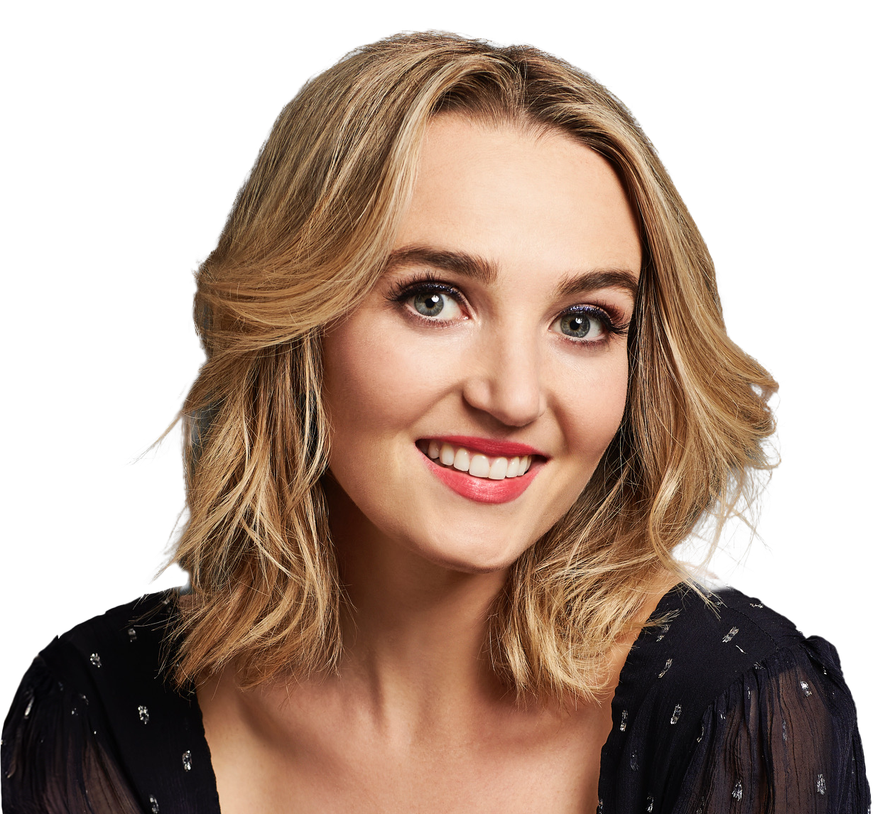 actress Chloe Fineman smiling on a white background