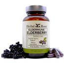 Bottle of Herbal Roots Eldermune Elderberry with capsules on the right of the bottle and fresh elderberries on the left.
