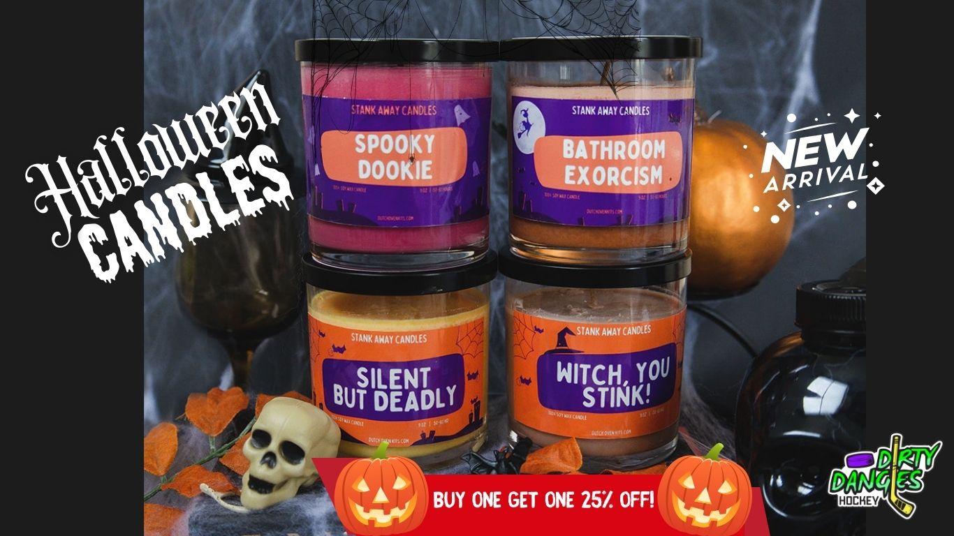4 stank away halloween candles on a spooky halloween background