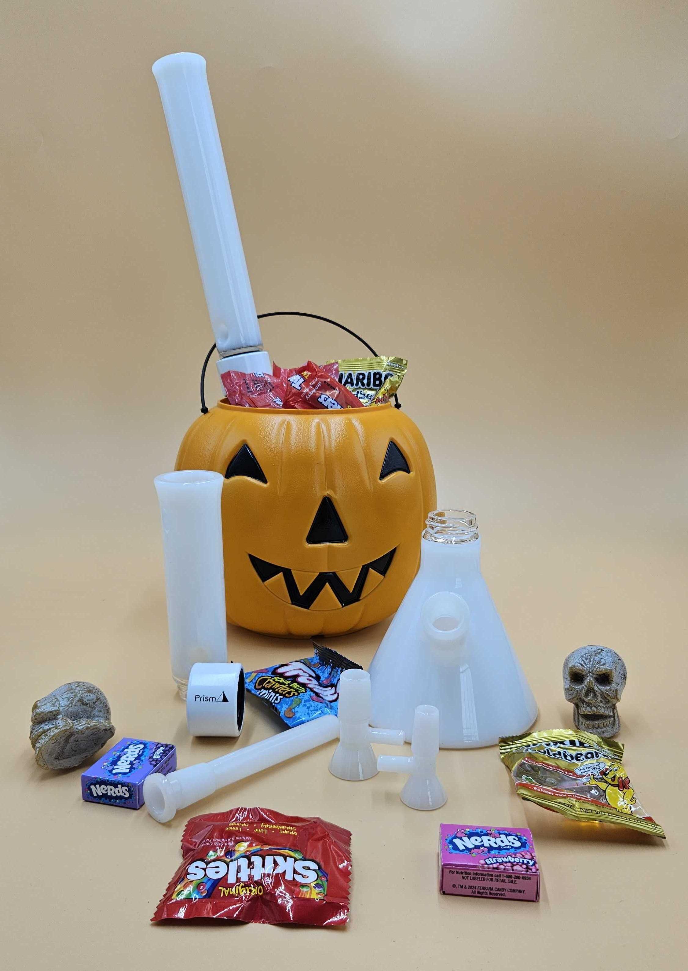 Disassembled Prism MINI Modular Single Stack Beaker Bong showcasing easy clean and customization features, pictured in a jack-o'-lantern candy bucket with Skittles and Nerds, perfect gear for a safe smoking weed and watching scary movies session and controlling the cannibal munchies threat.
