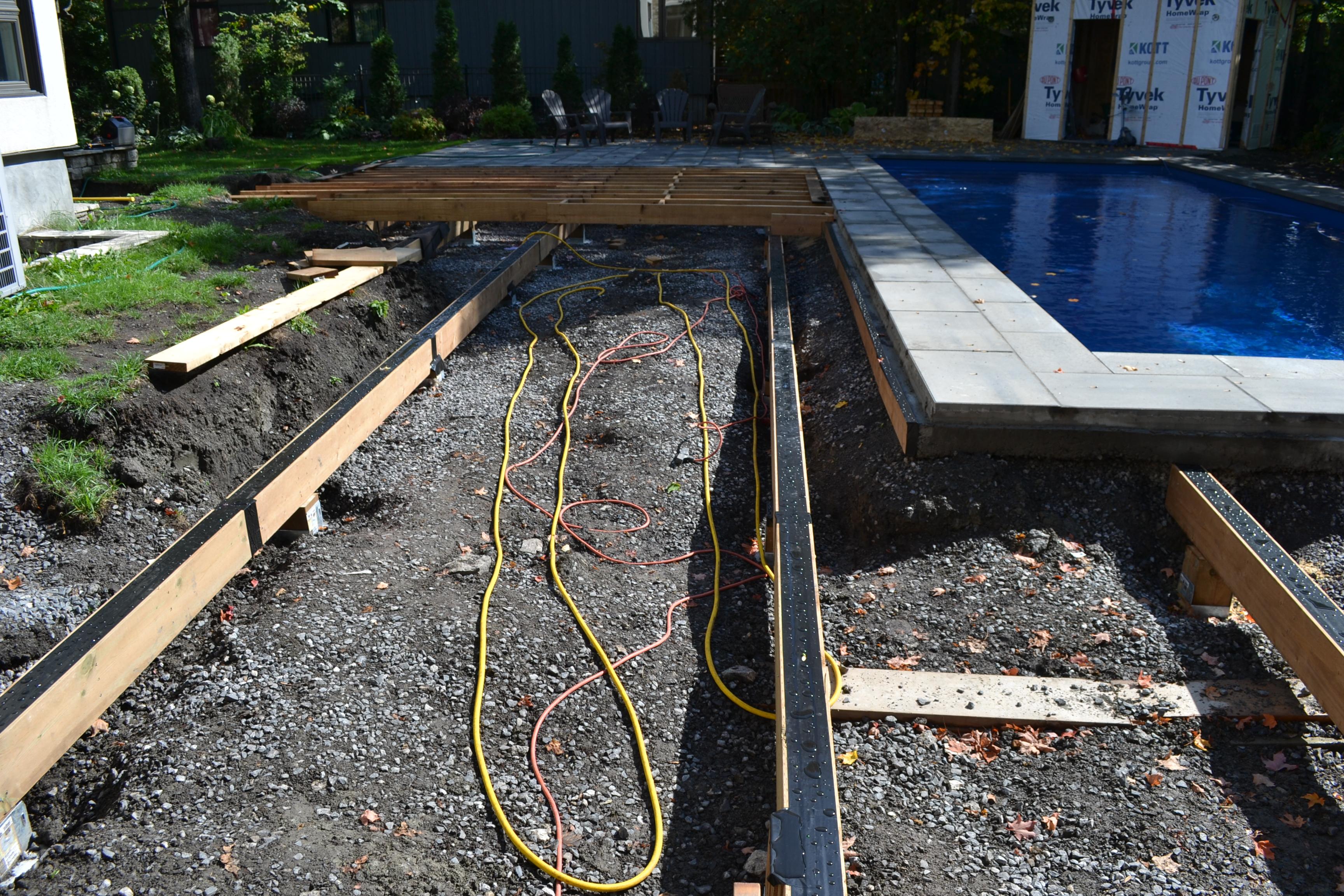 picture of the first deck beams going onto the deck foot anchors