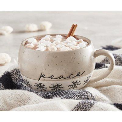 white mut with the word peace and snowflakes