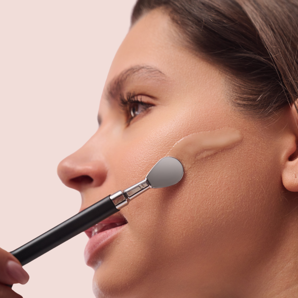 woman applying serum