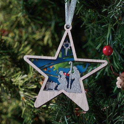 wooden star with image of nativity