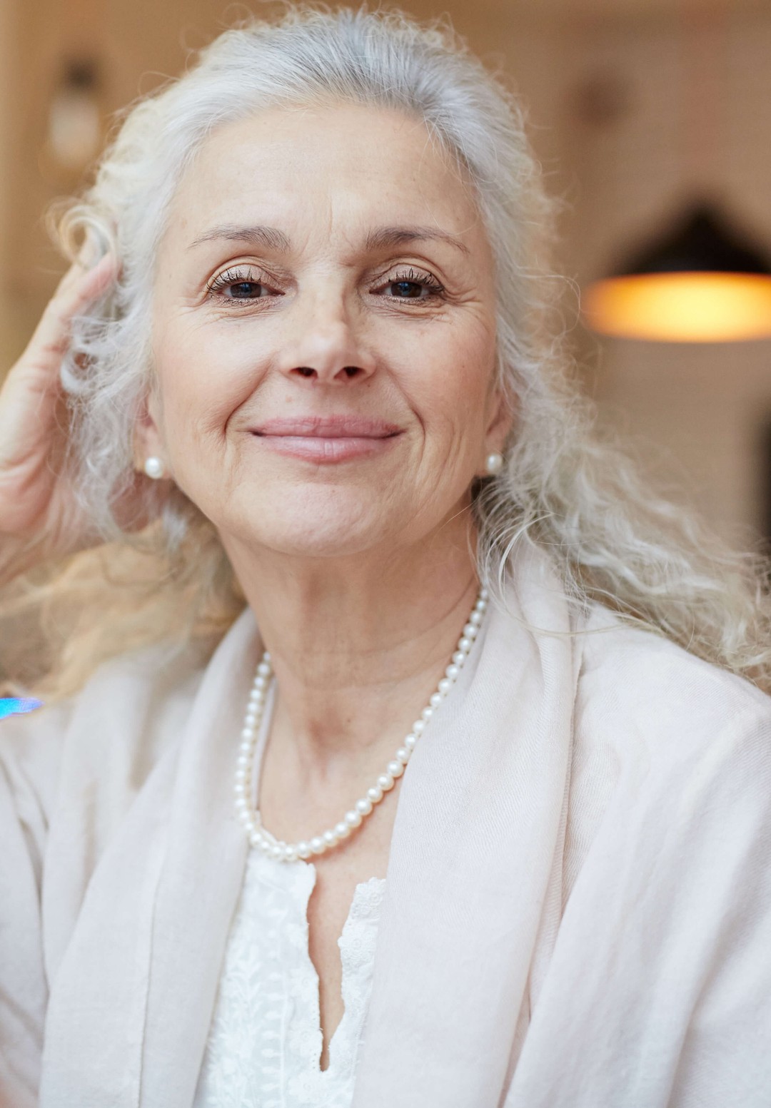 a gorgeous mature woman, with silver, full-bodied hair