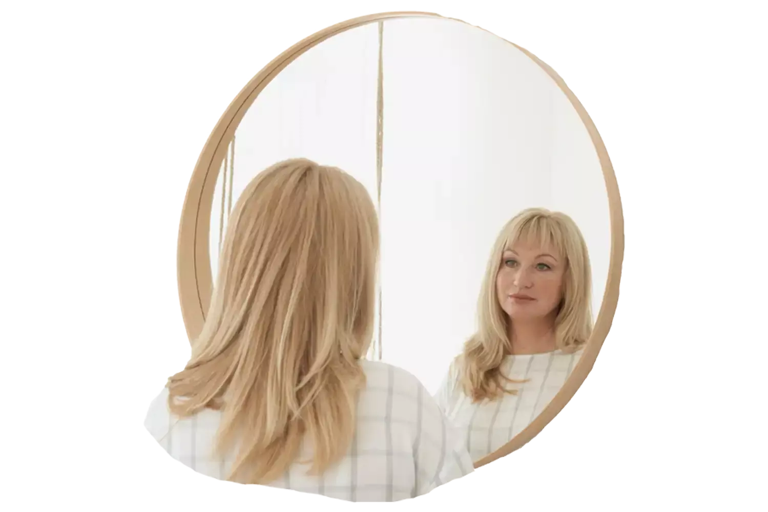 Woman looking at herself in mirror