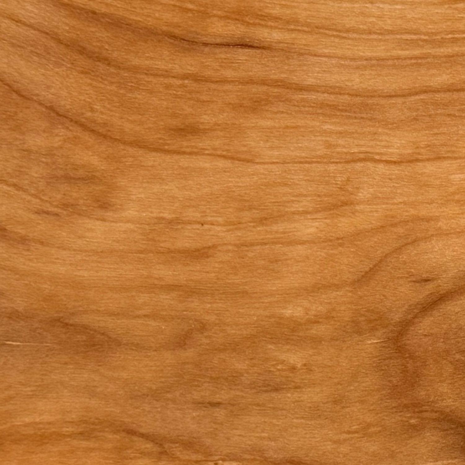 Cherry hardwood with warm reddish tone used for handcrafted kitchen boards