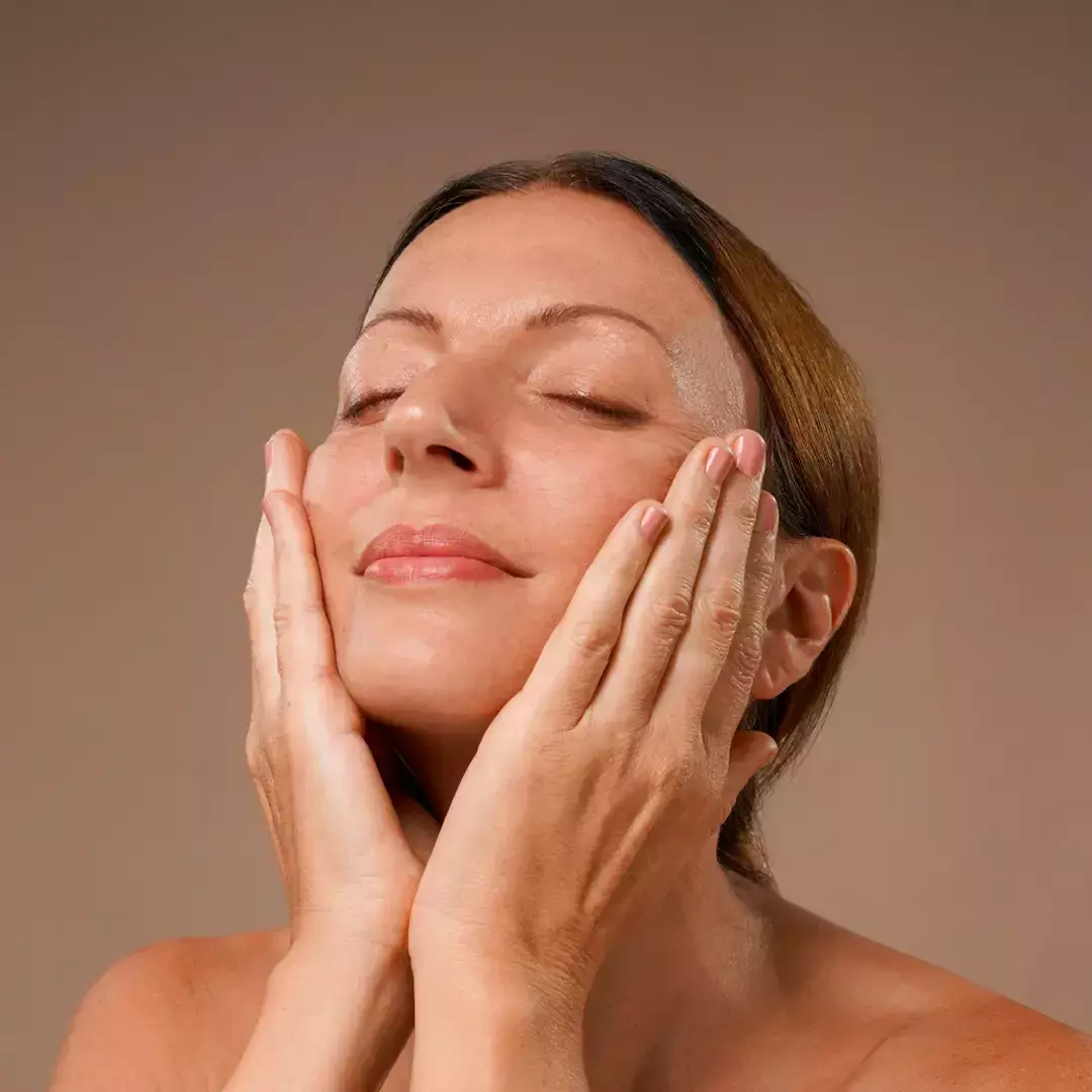 Women massaging face