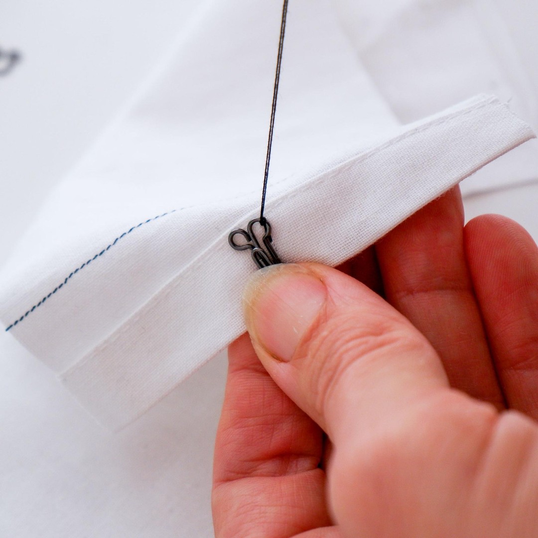 Sew a buttonhole stitch to secure the hook