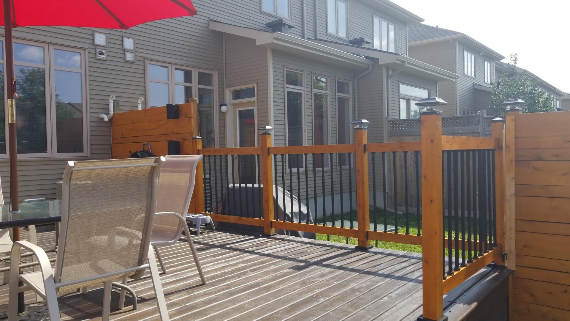 medium shot of a wooden pergola elevated on posts supported by the deck foot anchor