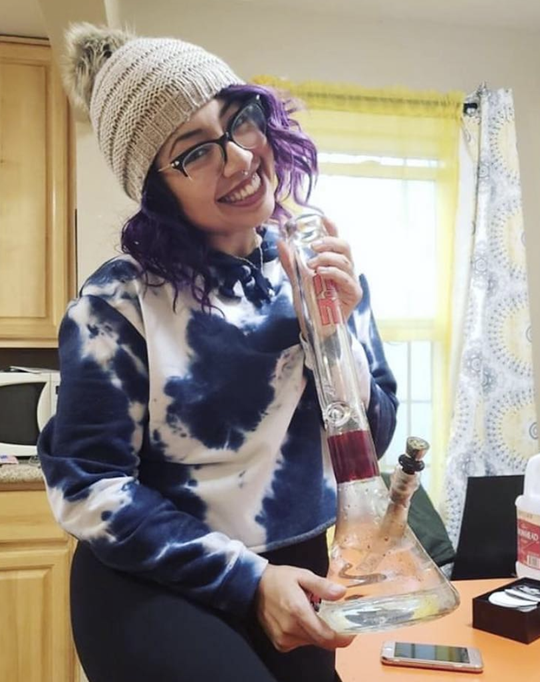 woman holding a dab rig