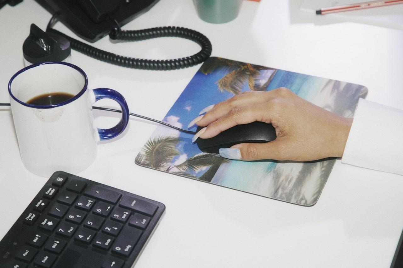 New World Wellness Woman in Office on Computer