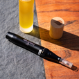 derma pen on a table with a serum