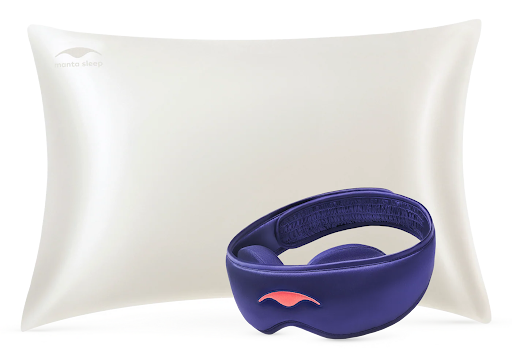 A cream silk pillowcase and a blue silk sleep mask.