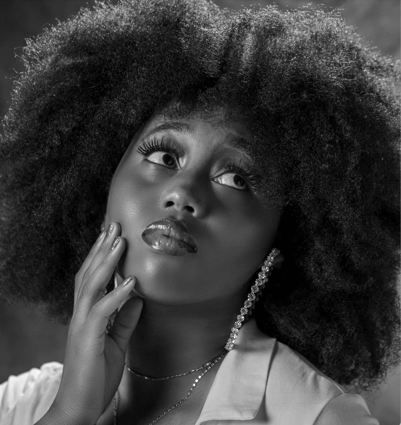 black woman with afro in a black and white photo
