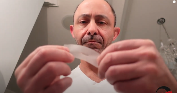 Man Holding Tape White Shirt