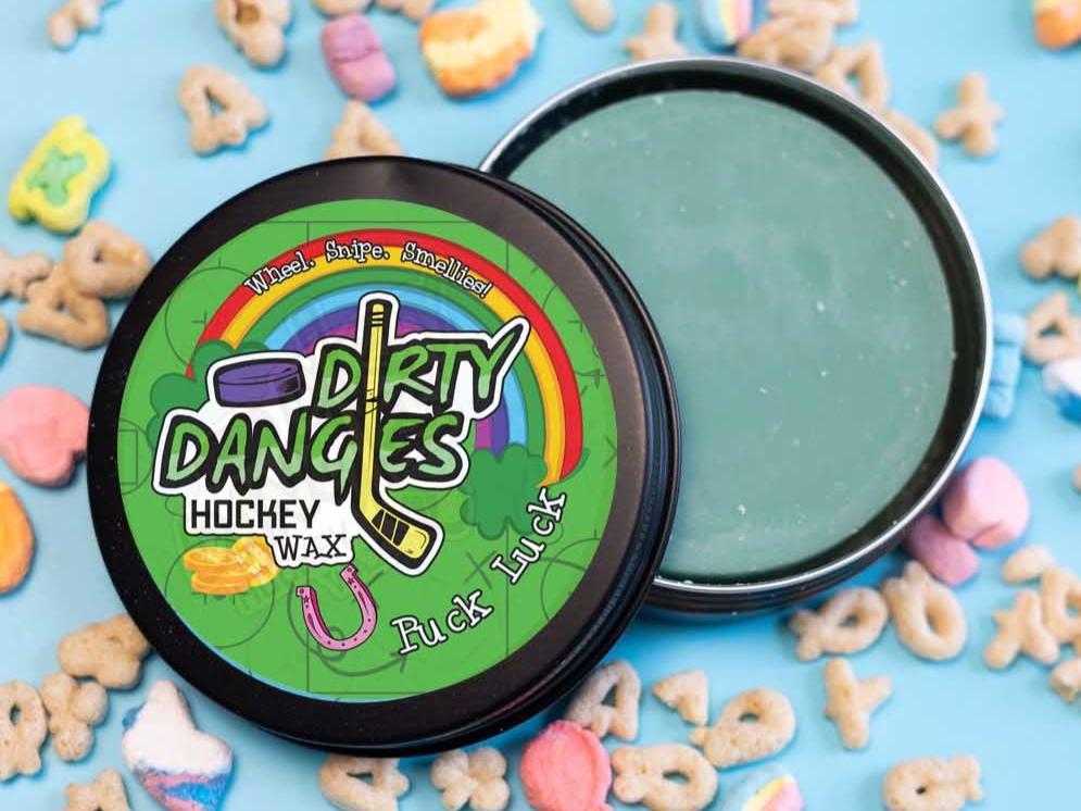 Fresh Churro Scented hockey stick wax on a blue background surrounded by cinnamon and sugar