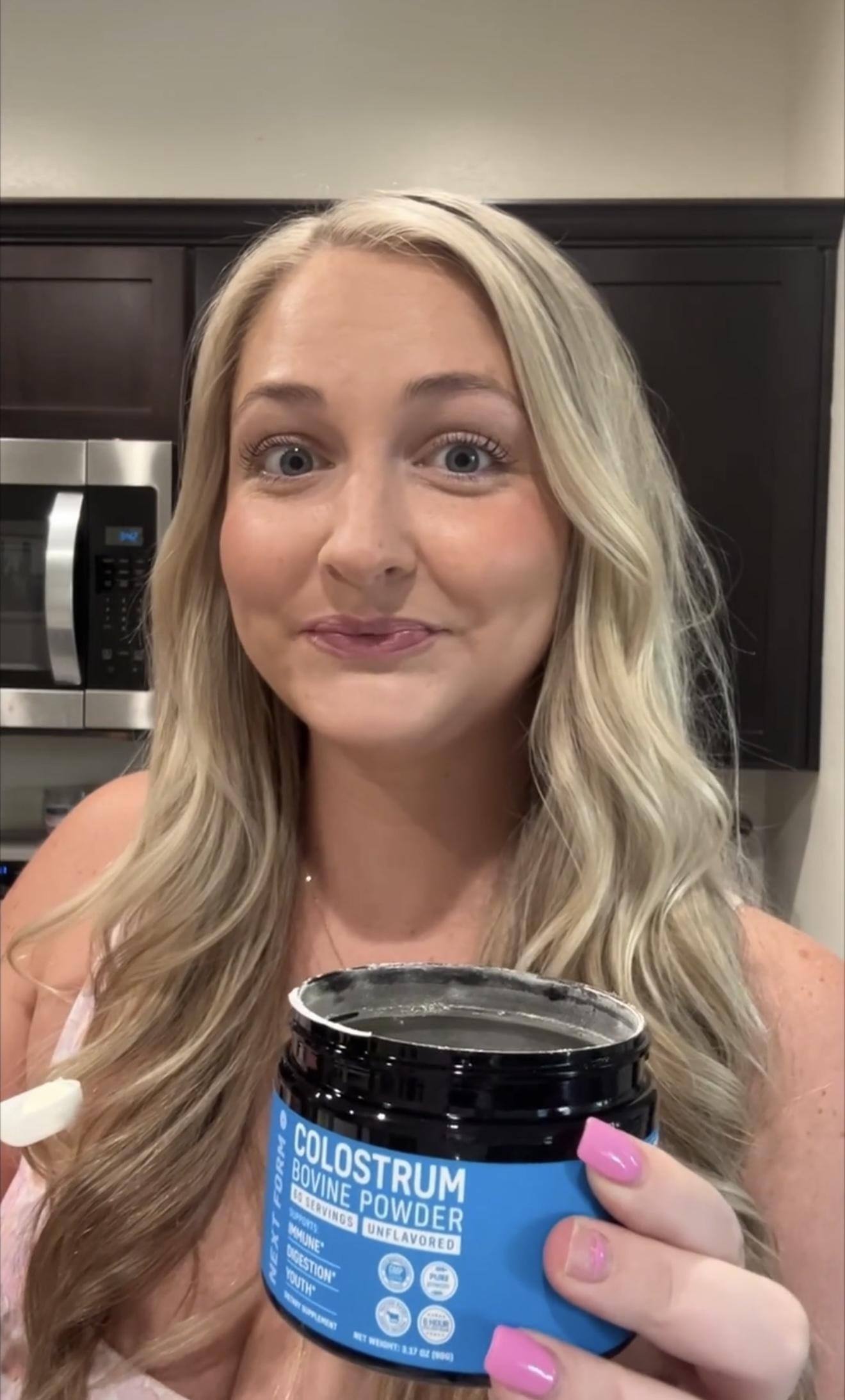 happy woman enjoying gut health benefits of colostrum