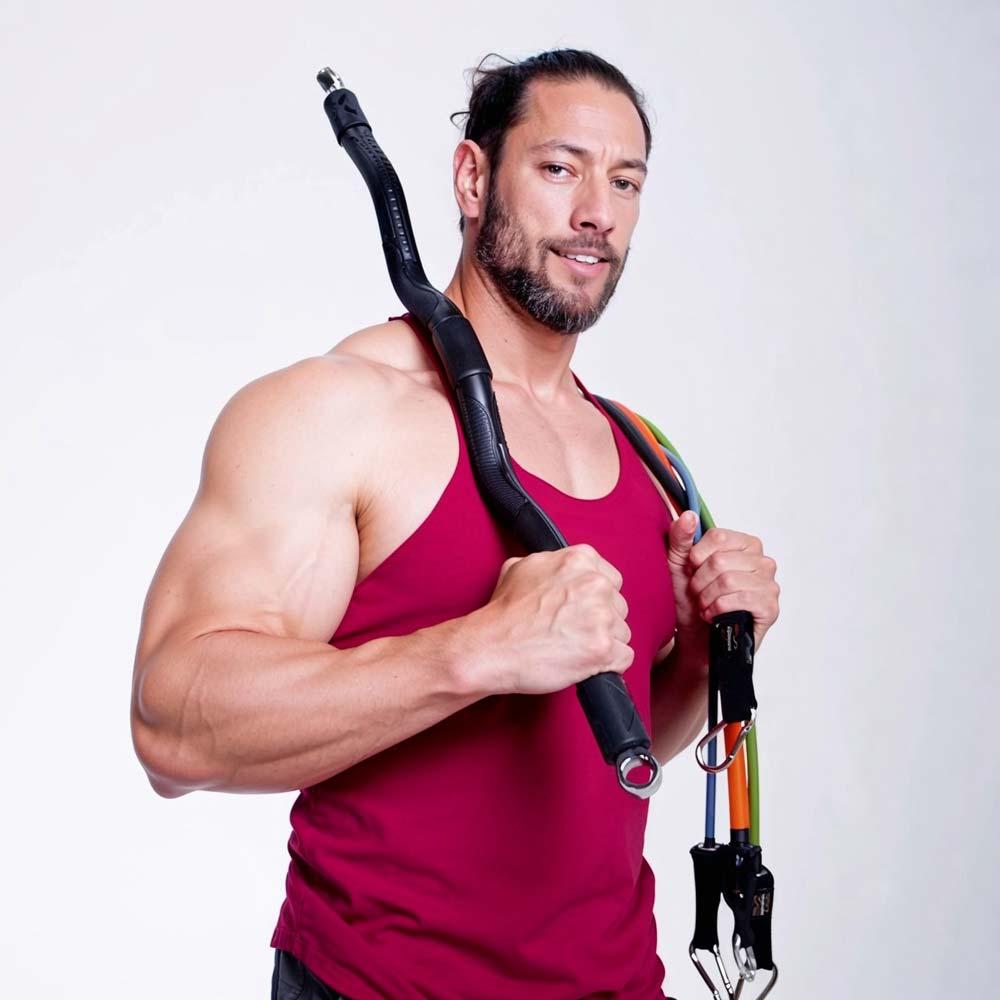 man holding xbar fitness resistance bar and bands