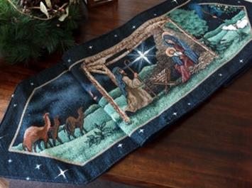 blue table runner with Nativity scene including stable, camels, and sheep