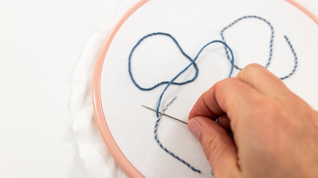 This image shows whipped back stitch in a curved shape in a hoop.