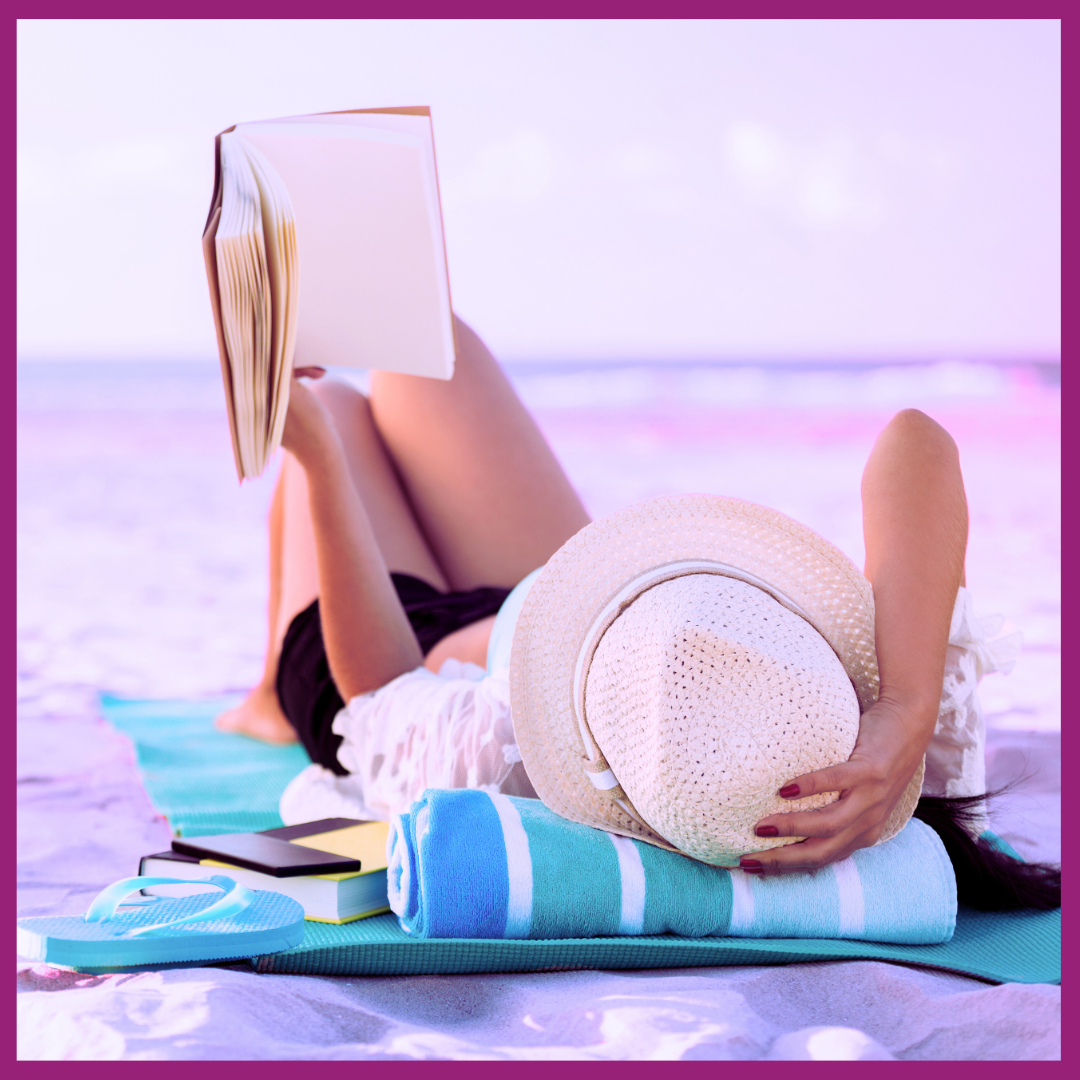 image of woman reading on beach