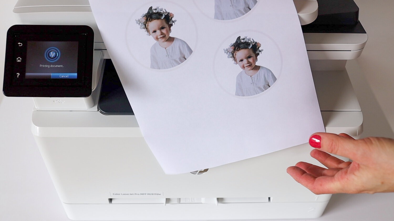 A printer prints out photos.