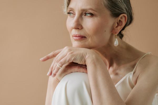 mature woman posing elegantly for a picture.