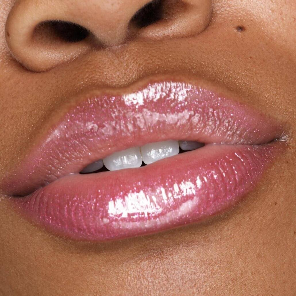 Plumping Lip Gloss - Pink Pout on model lips