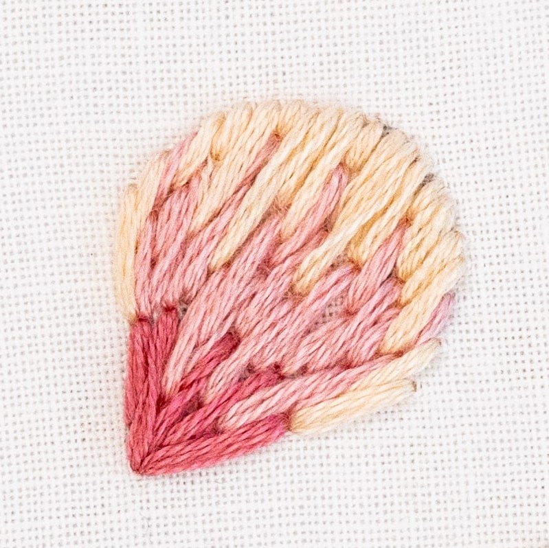 This is an image of a flower petal stitched with Long and Short Stitch.