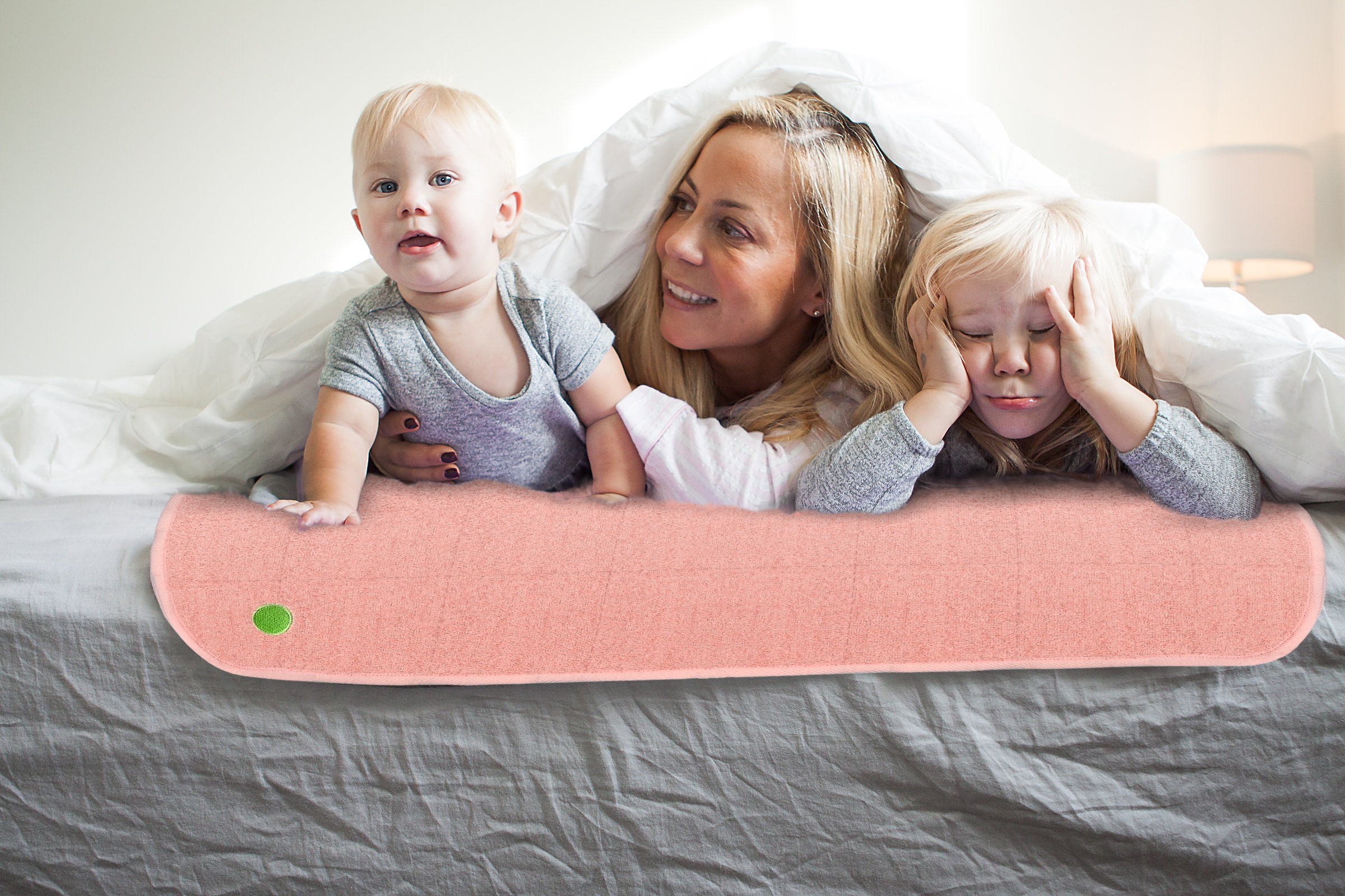 family on waterproof bed mat - PeapodMat