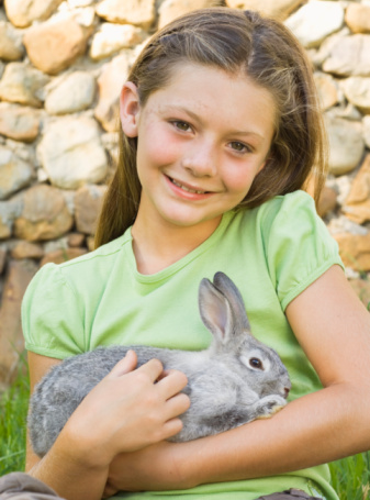 girl holding rabbit