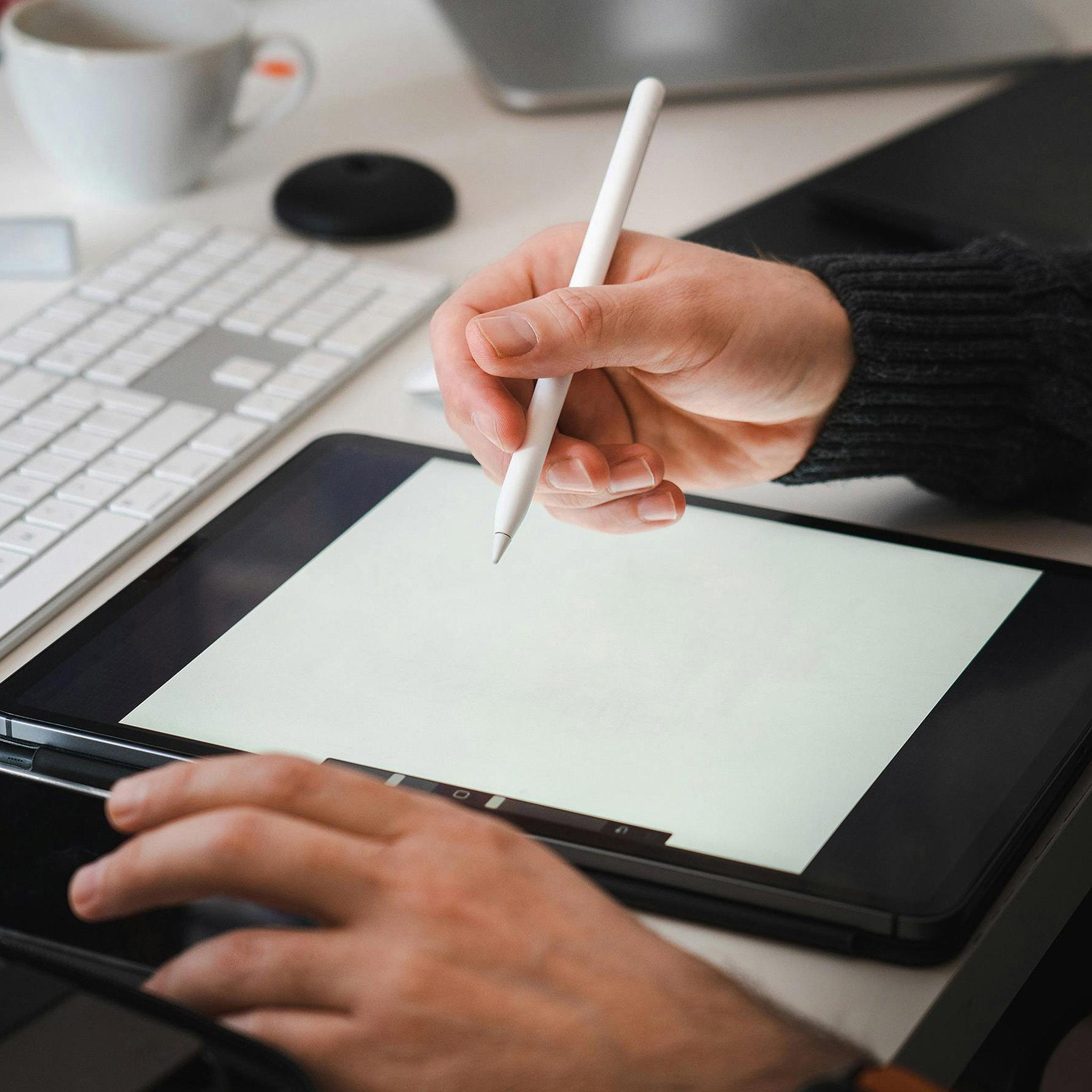 Hand writing on iPad with Apple Pencil in digital planner