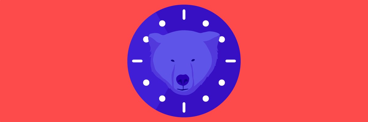 A bear’s face at the center of a round clock.