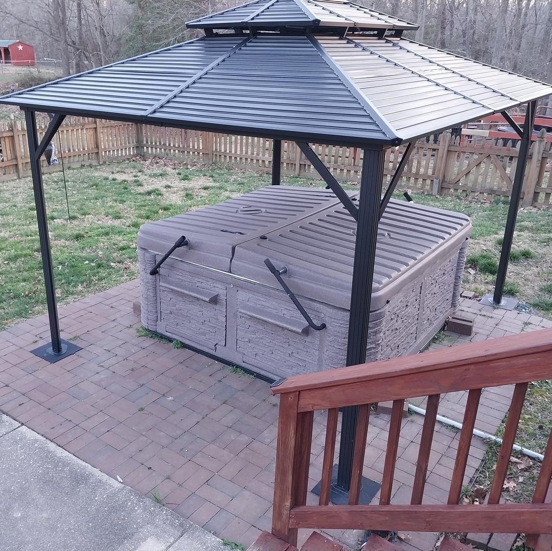 4-post metal pergola installed over pavers