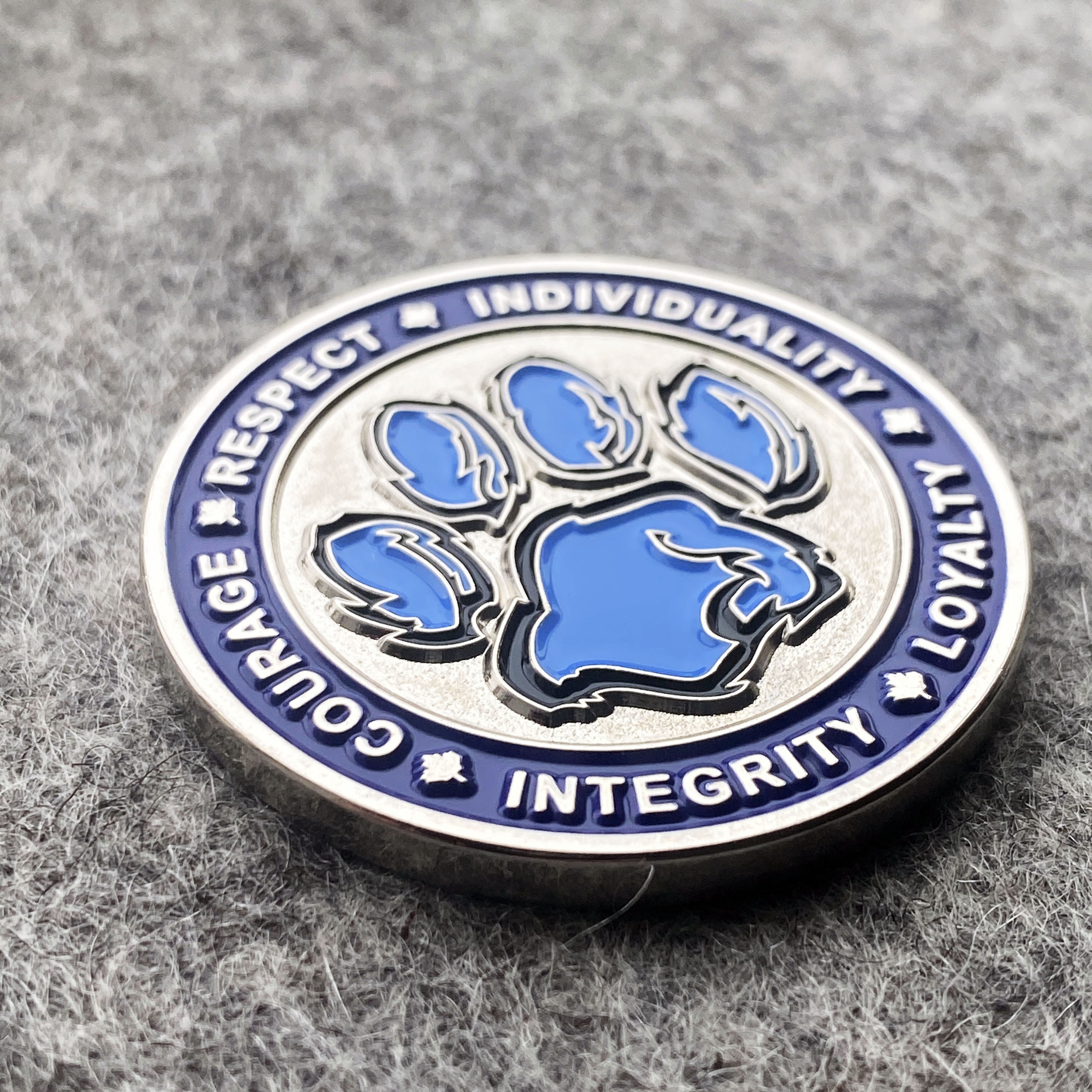 custom challenge coin for a school with motto and paw symbol