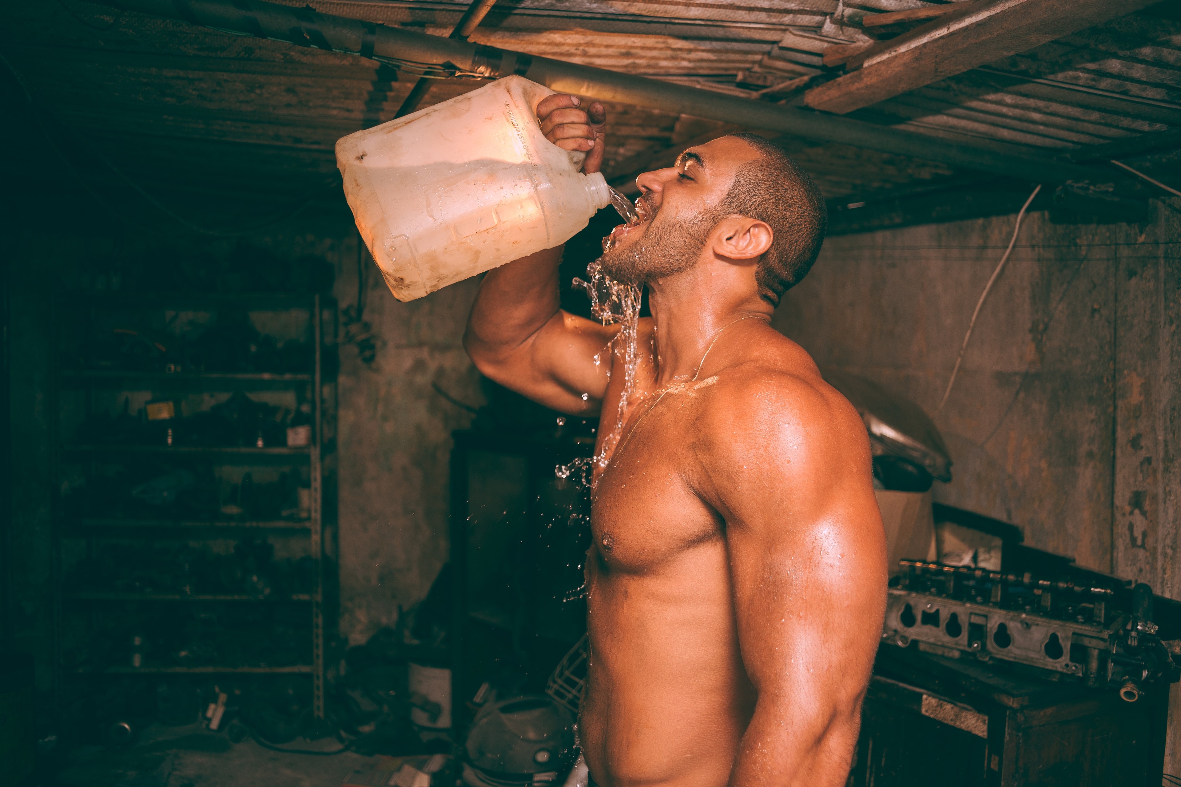 guy drinking a lot of water when working out