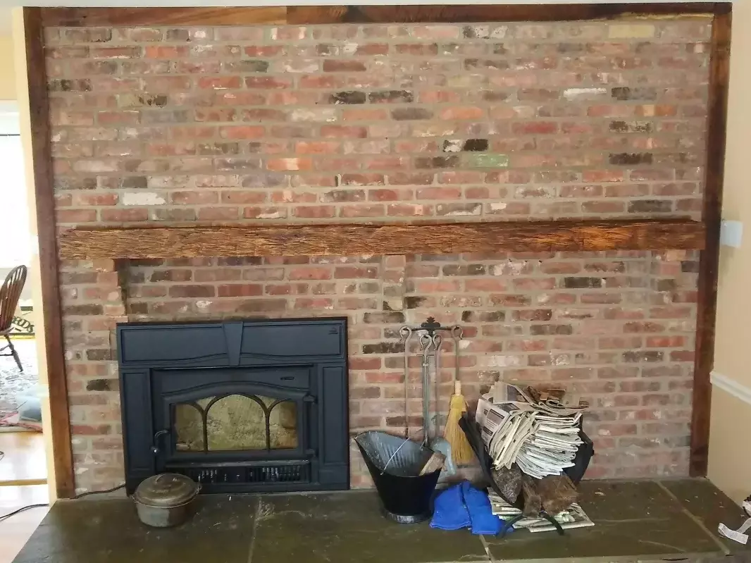 Reclaimed Wood Mantel on Brick Wall