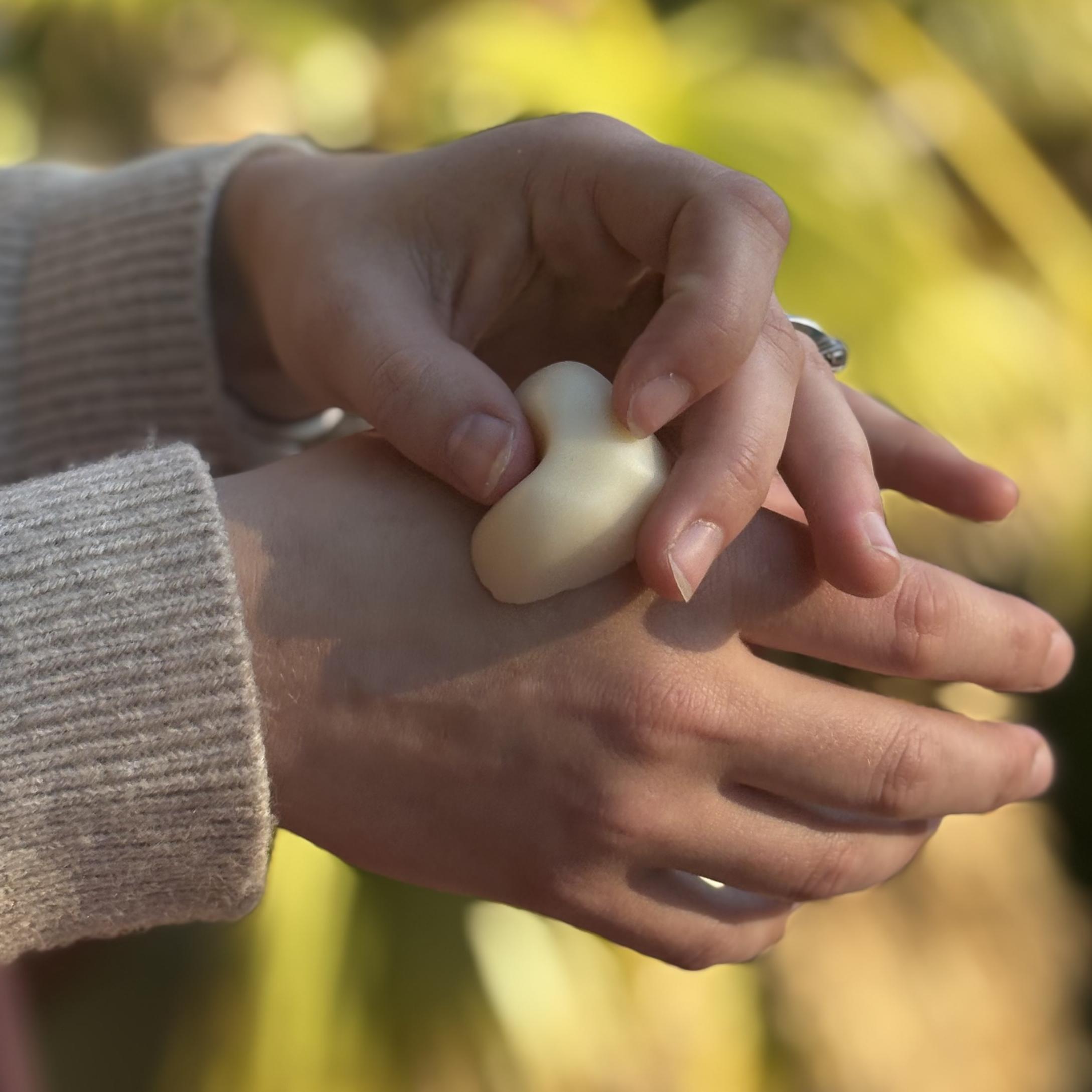 hand holding lotion bar