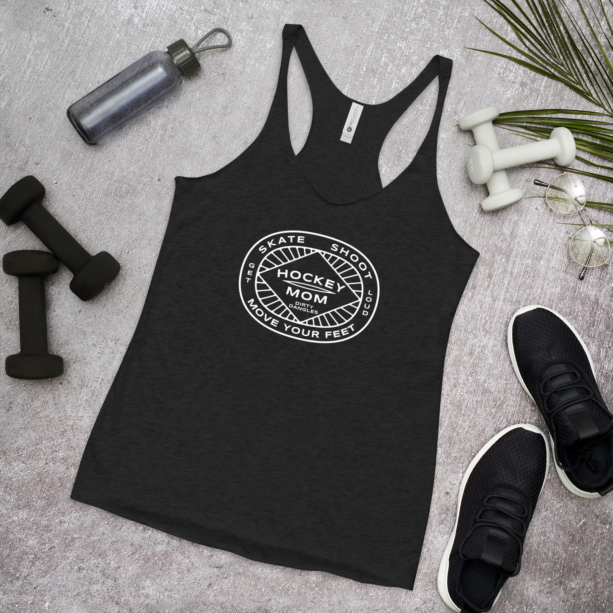 A black racerback tank top on a gray background with exercise equipment. Hockey mom insignia. Skate shoot move your feet.