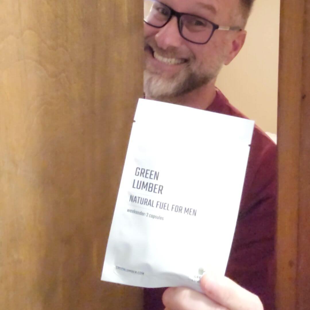 Man holding pack of Natural Fuel for Men and opening door