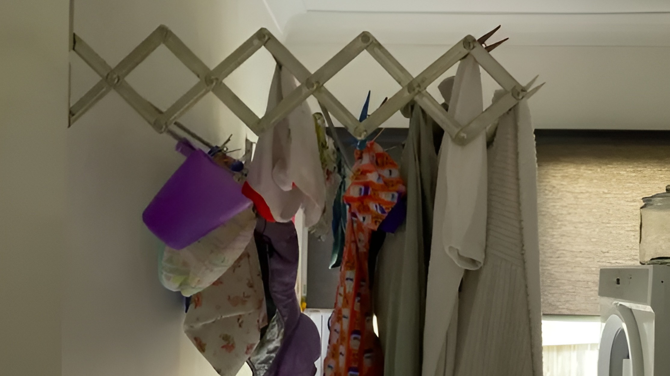 Wall Mounted Drying Rack Catering to Different Laundry Loads