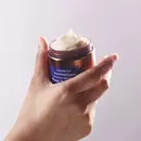 Woman opened Cerabuild Face and Neck Cream