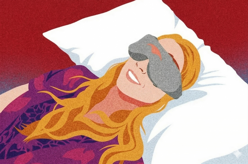 A woman lying down on a pillow wearing an eye mask, enjoying the sleep mask benefit of improved sleep quality.