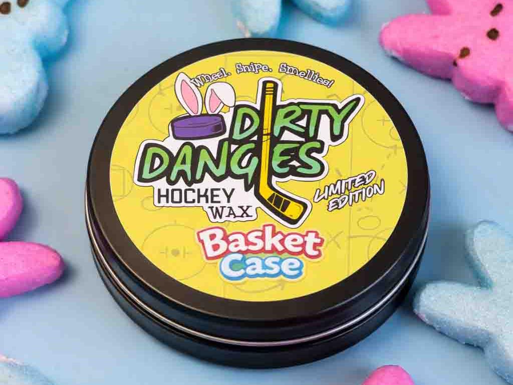 Dirty Dangles Hockey Wax Basket Case marshmallow candy scented hockey wax surrounded by colorful marshmallow Peeps on a light blue background