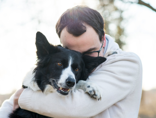 Selvita Canine Man Hugging Dog