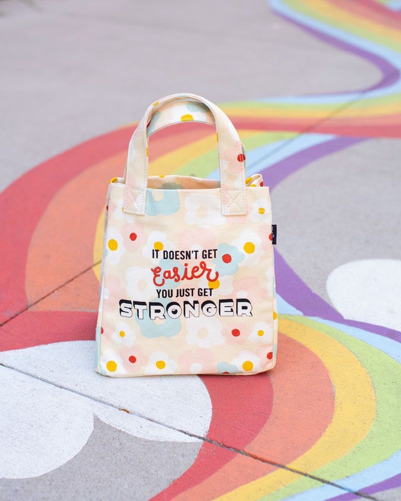 MAika goods lunch tote with slogan " it doesn't get easier you just get stronger."