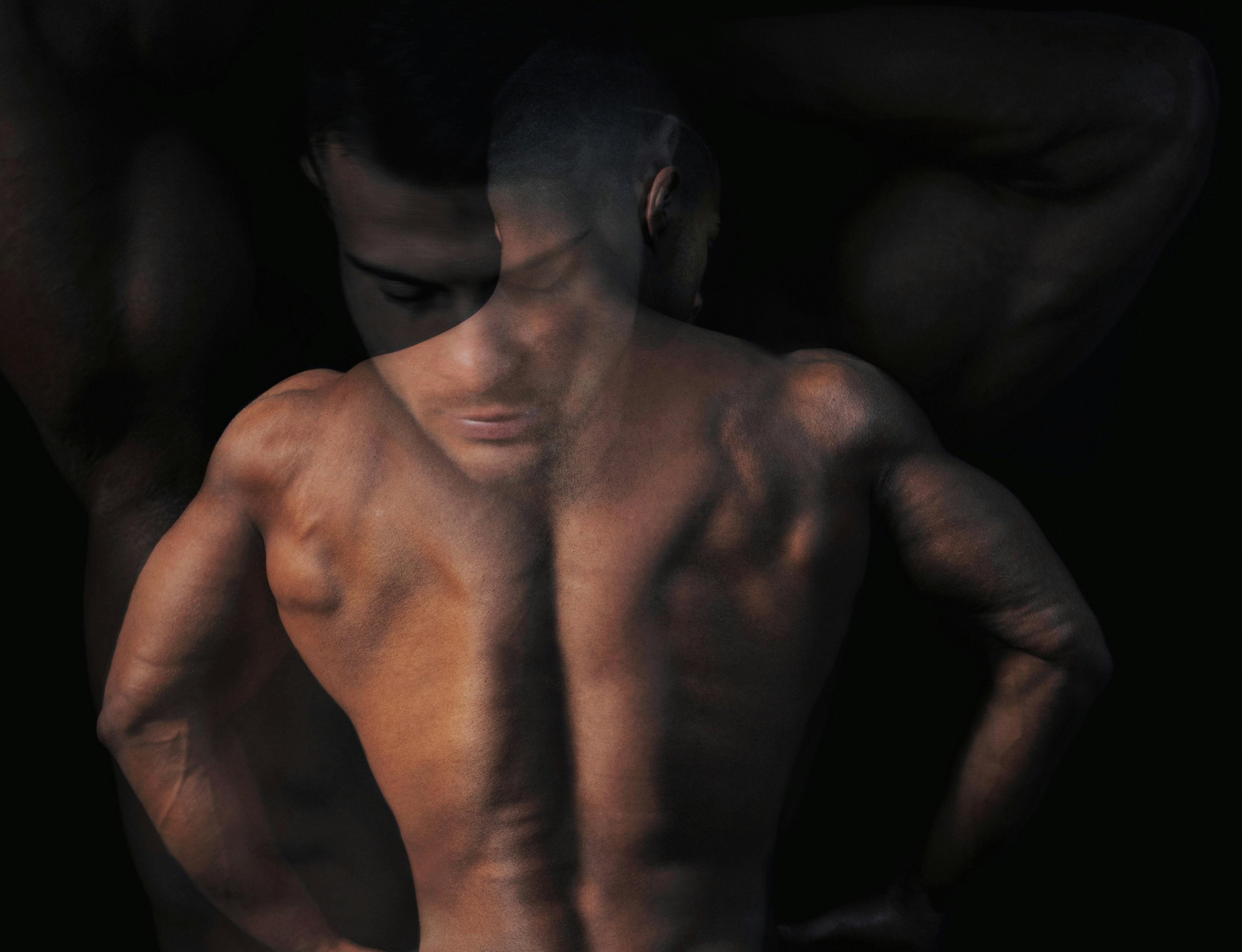 man shirtless showing back muscles